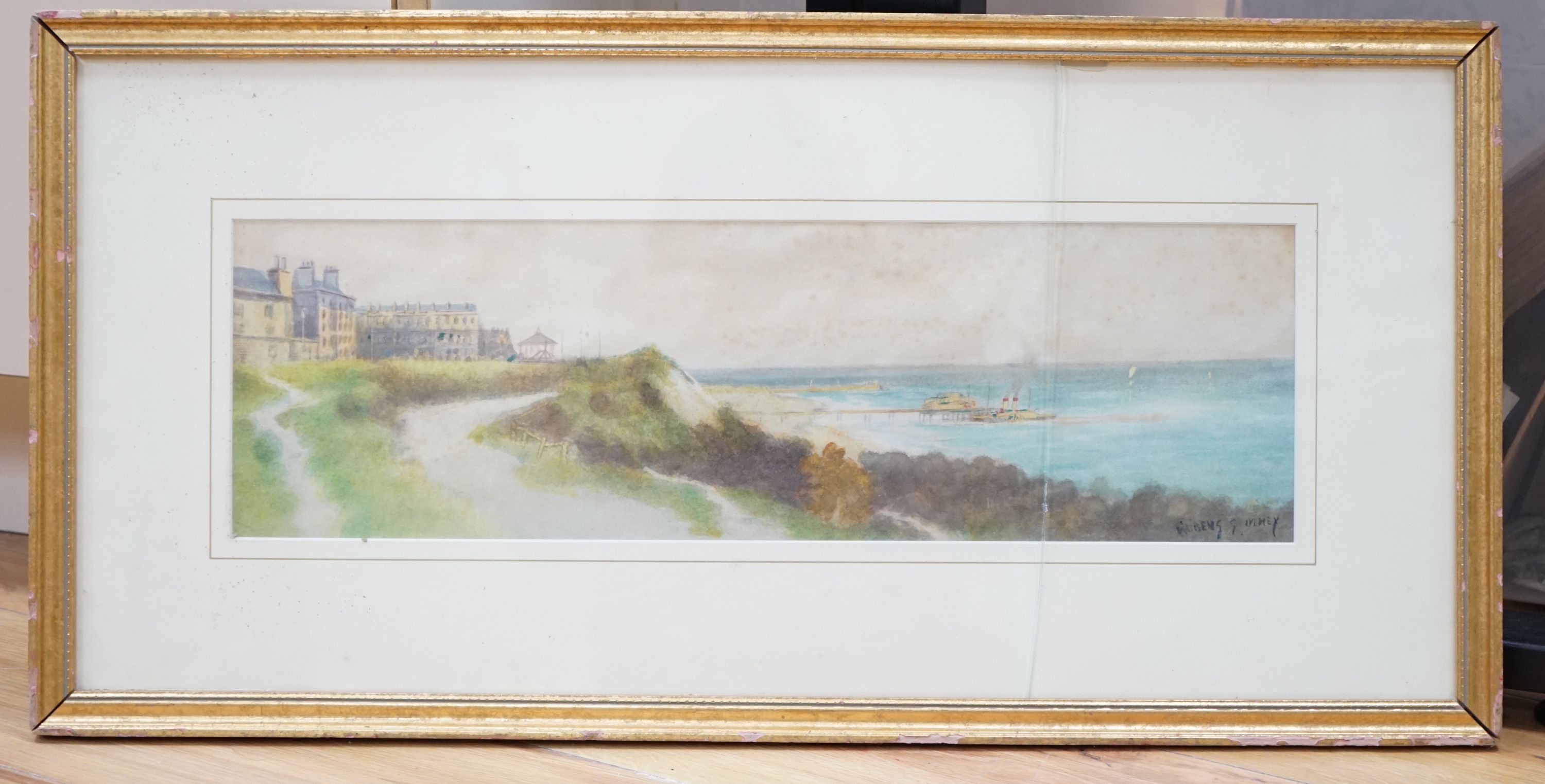 Rubens Southey (1881-1933), watercolour, Coastal town with paddle steamer beside a pier, signed, 15 x 51cm